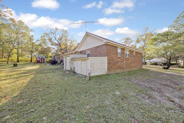 view of side of home featuring a yard