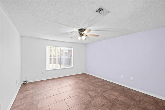 spare room with ceiling fan and a textured ceiling