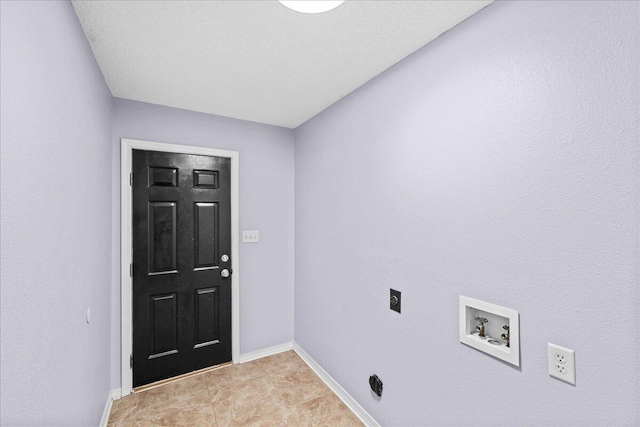 washroom with washer hookup, hookup for an electric dryer, and a textured ceiling