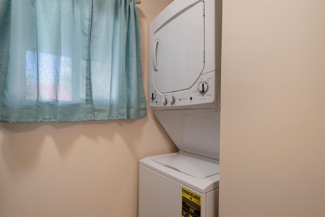 washroom with stacked washer and dryer