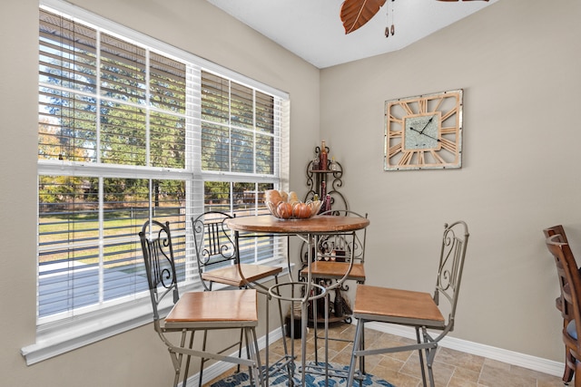 dining room with a wealth of natural light and ceiling fan