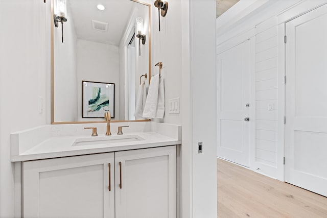 bathroom with wood-type flooring and vanity