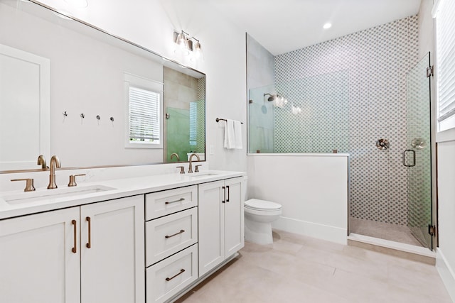 bathroom with tile patterned flooring, toilet, vanity, and walk in shower