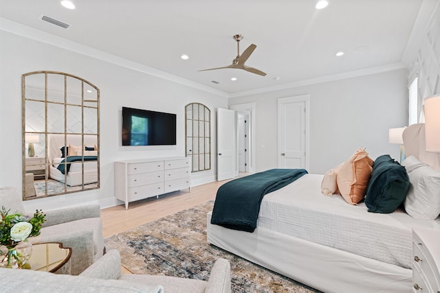 bedroom with light wood-type flooring, ceiling fan, and ornamental molding