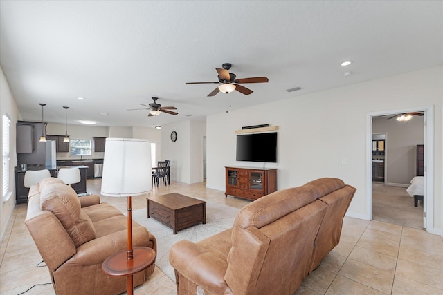 tiled living room featuring ceiling fan