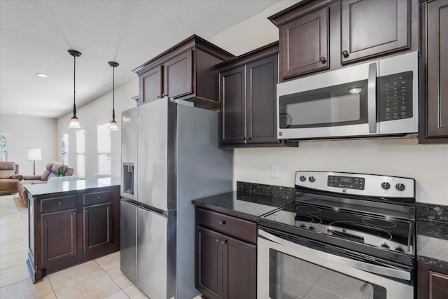 kitchen featuring pendant lighting, dark brown cabinets, light tile patterned floors, and appliances with stainless steel finishes