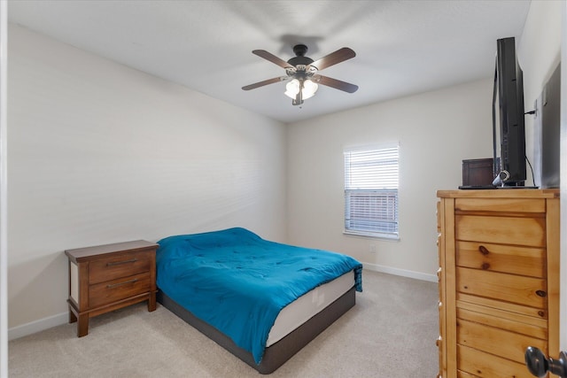 bedroom with ceiling fan and light colored carpet