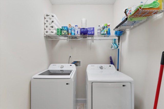 clothes washing area with washer and dryer