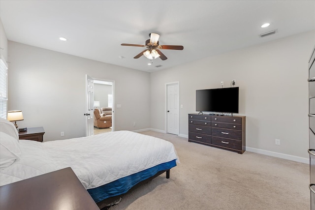 bedroom featuring ceiling fan and light carpet