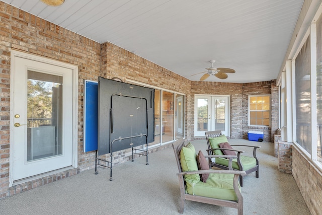 sunroom / solarium with ceiling fan