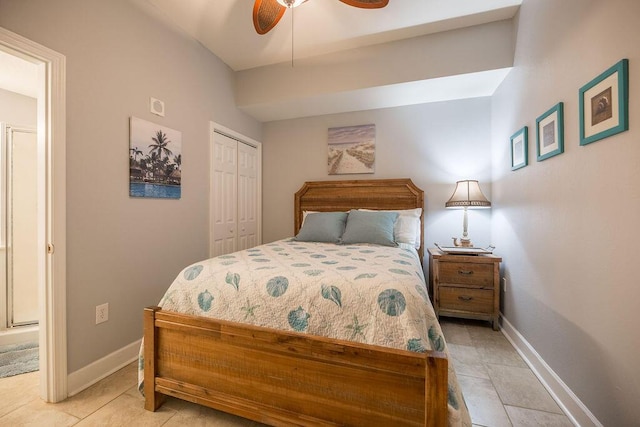 tiled bedroom with ceiling fan and a closet