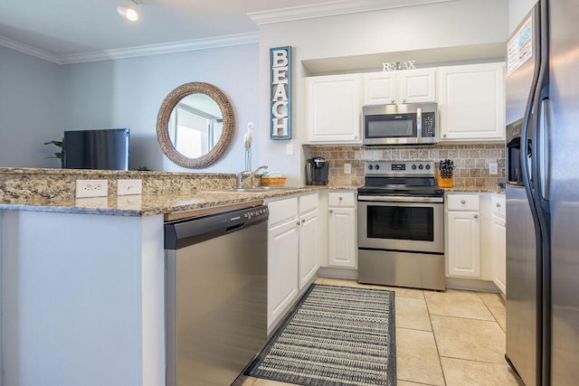 kitchen featuring light stone countertops, white cabinetry, sink, and appliances with stainless steel finishes