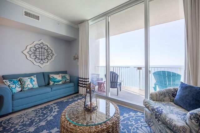 living room featuring expansive windows and ornamental molding