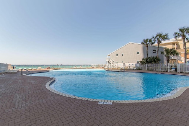 view of pool featuring a patio