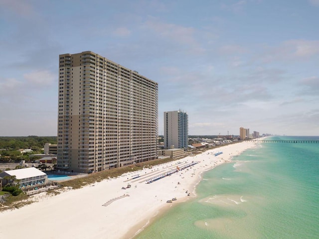 bird's eye view featuring a water view and a view of the beach