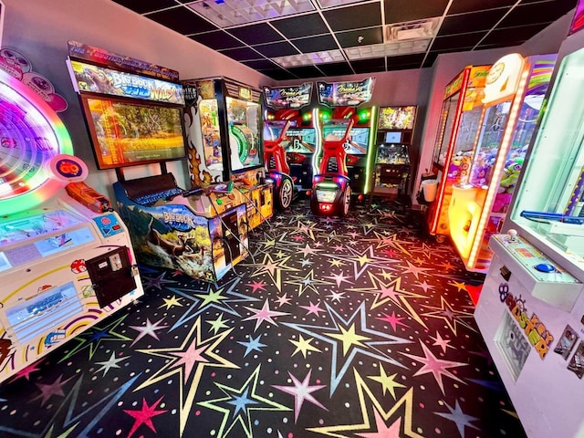 playroom with a paneled ceiling