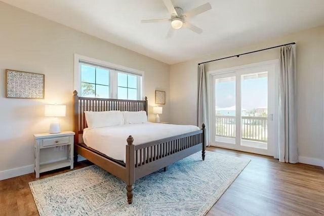 bedroom with access to exterior, ceiling fan, and light hardwood / wood-style floors