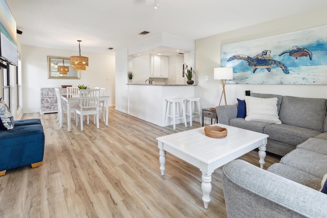 living room with light hardwood / wood-style floors