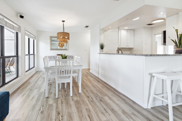 dining room with light hardwood / wood-style floors