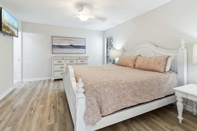 bedroom featuring light wood-type flooring and ceiling fan