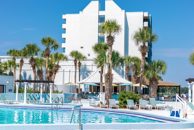 view of swimming pool with a patio and a gazebo