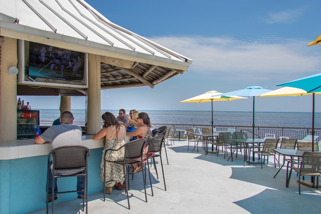 view of patio with an outdoor bar