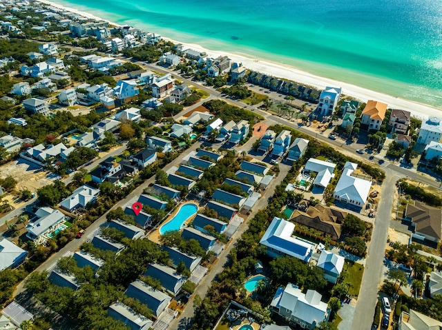 drone / aerial view with a water view and a view of the beach