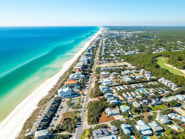 drone / aerial view with a water view and a beach view