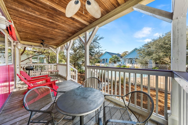 wooden deck with ceiling fan