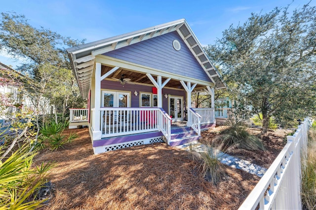 view of front of house featuring ceiling fan, french doors, and covered porch