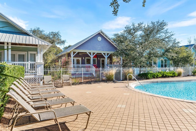 view of swimming pool with a patio