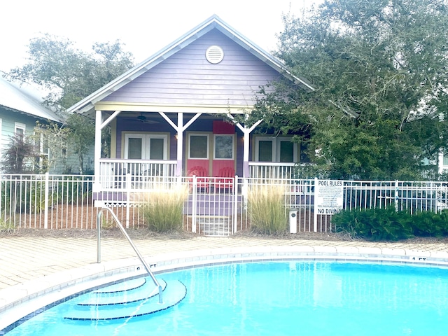 view of pool featuring ceiling fan