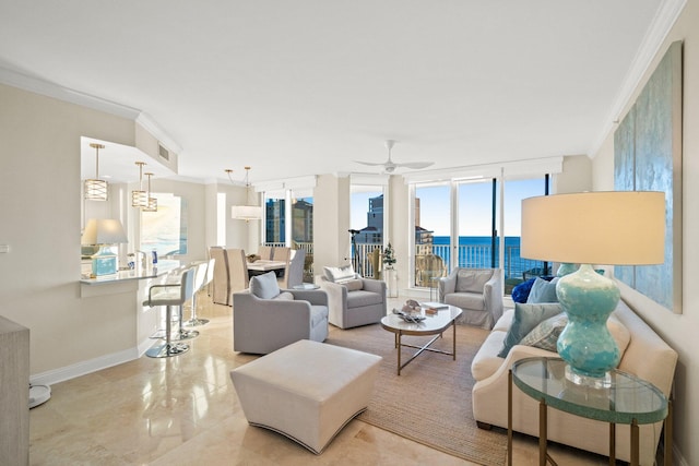 living room with ceiling fan, a water view, and ornamental molding