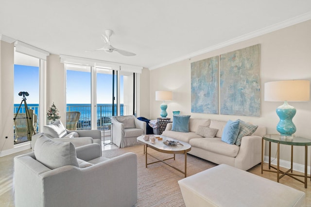 living room featuring a wall of windows, ceiling fan, a water view, and ornamental molding