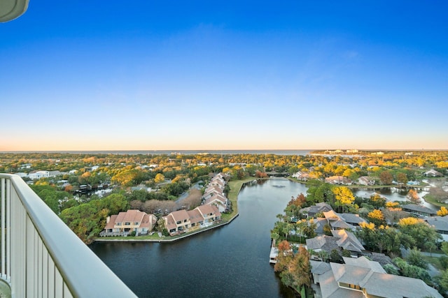 aerial view at dusk with a water view