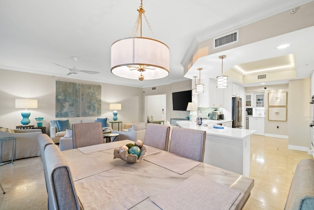 dining room featuring light tile patterned floors, ceiling fan, and crown molding