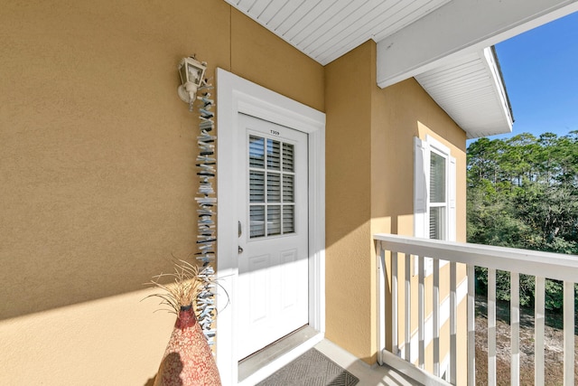 entrance to property with a balcony