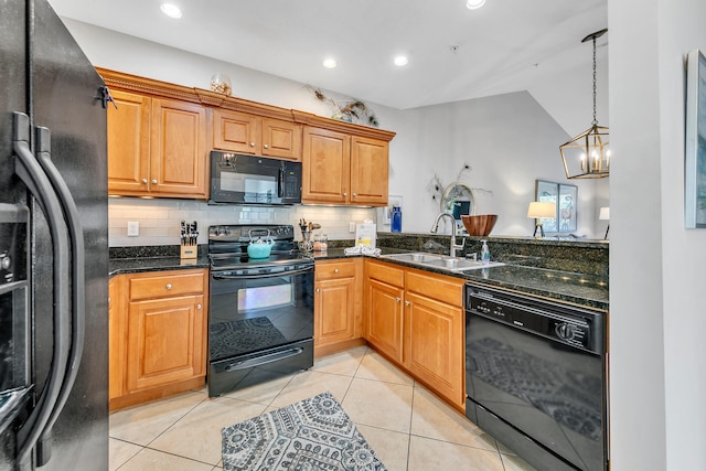 kitchen with sink, light tile patterned floors, black appliances, and a notable chandelier