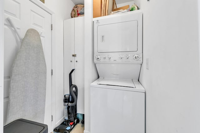 laundry area featuring stacked washer / dryer