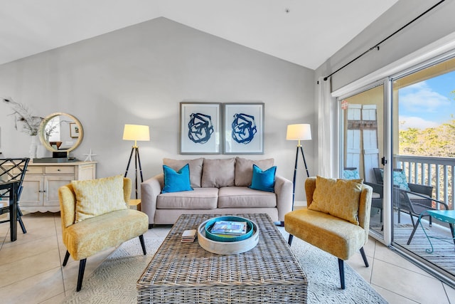 living room with light tile patterned floors and lofted ceiling