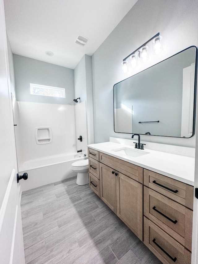 full bathroom featuring shower / bathing tub combination, vanity, toilet, and hardwood / wood-style flooring