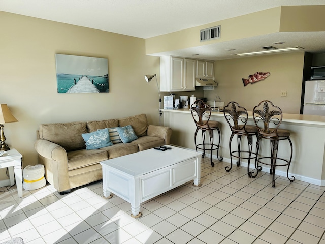 2830 Scenic Gulf Dr Unit 115, Miramar Beach, FL 32550 - living room with light tile patterned flooring and baseboards