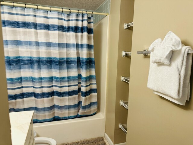 2830 Scenic Gulf Dr Unit 115, Miramar Beach, FL 32550 - bathroom featuring shower / tub combo, a textured ceiling, and vanity