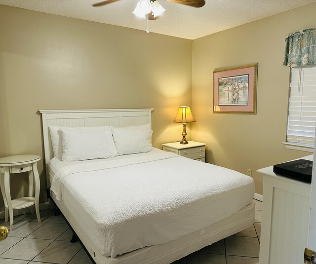 2830 Scenic Gulf Dr Unit 115, Miramar Beach, FL 32550 - bedroom with light tile patterned floors and a ceiling fan