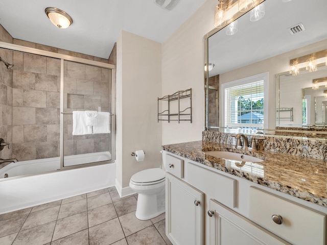 full bathroom with tile patterned flooring, vanity, toilet, and enclosed tub / shower combo