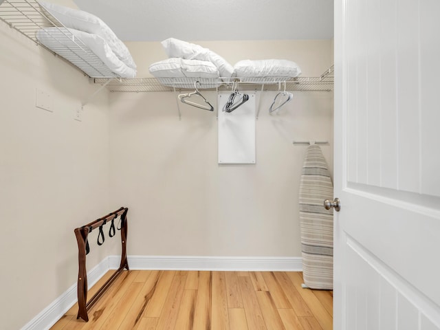 walk in closet featuring hardwood / wood-style floors