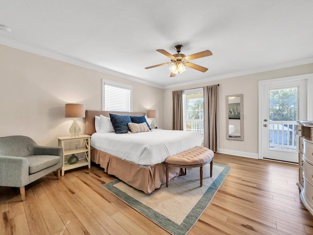 bedroom with access to outside, multiple windows, ceiling fan, and light wood-type flooring