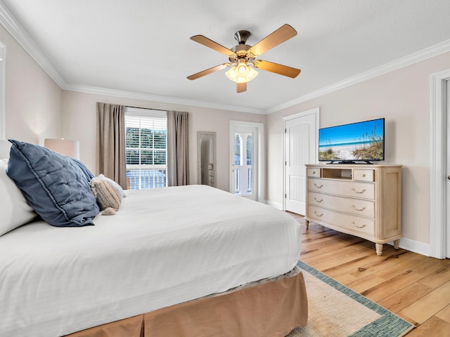 bedroom featuring ceiling fan, ornamental molding, and light hardwood / wood-style flooring