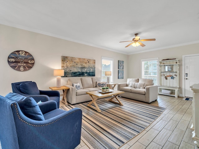 living room featuring ceiling fan and ornamental molding