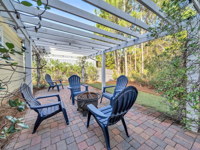 view of patio / terrace with a pergola and an outdoor fire pit